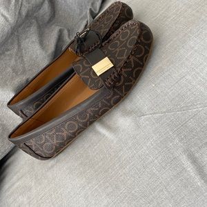 Calvin Klein brown with gold color